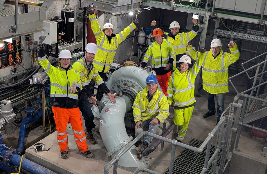 Image show RheEnergise's engineers in the system power house celebrating this major milestone.