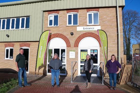 Colleagues and volunteers from Arthur Rank Hospice Charity’s Retail Hub team outside the building on the Eastern Leather Industrial Estate between Sawston and Pampisford. The Grand Reopening will take place in the car park on Saturday 10 July. 