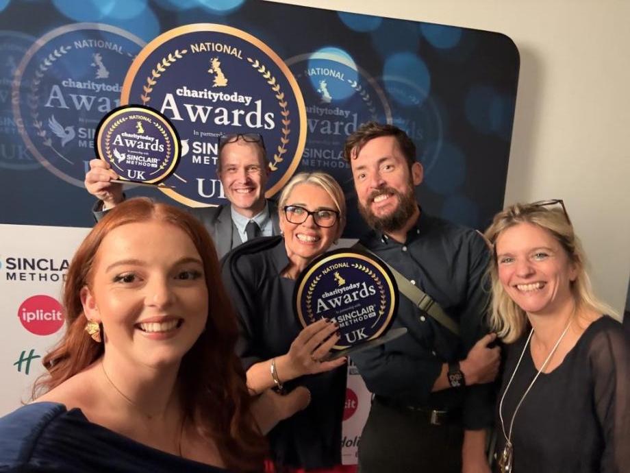 The ACT team accept their Charity of the Year award