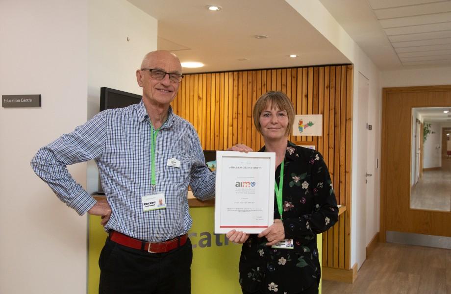Male and female holding a certificate at Arthur Rank Hospice Charity Venue Hire reception 