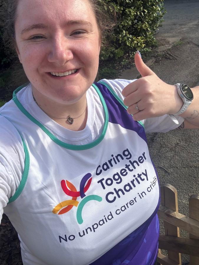 Alice in her Caring Together Charity vest, getting ready to run