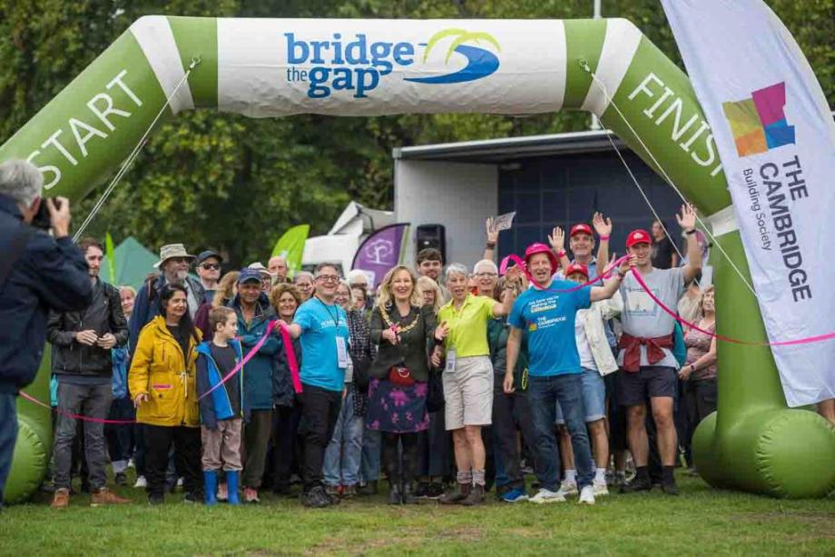 A large group of people at the start line of Bridge the Gap