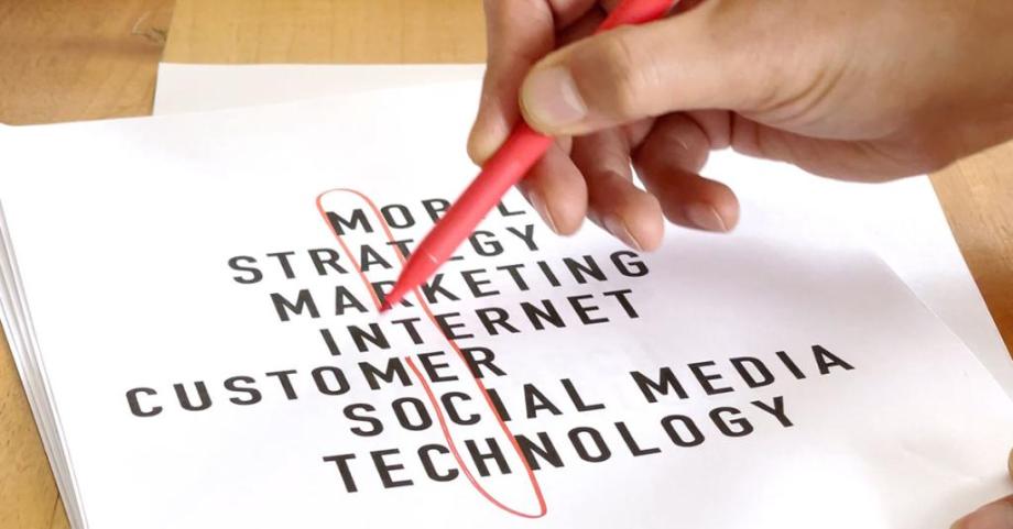 A pen circles the word 'MarTech' - which is made up from letters mobile, strategy, marketing, internet, customer, social media, technology in an acrostic format