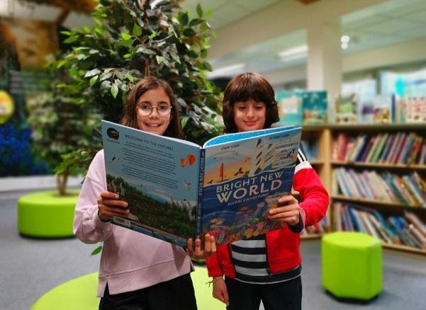 Children reading Bright New World
