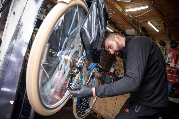 man fixing bike 