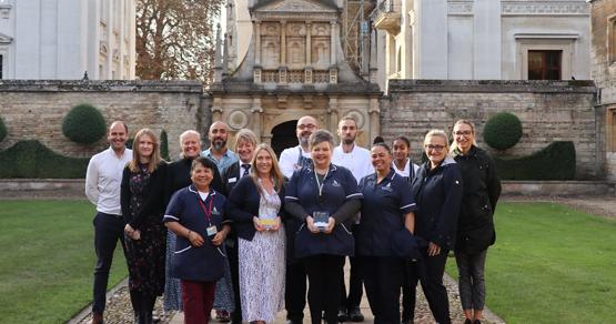  Gonville & Caius Team hold award for Best Customer Service