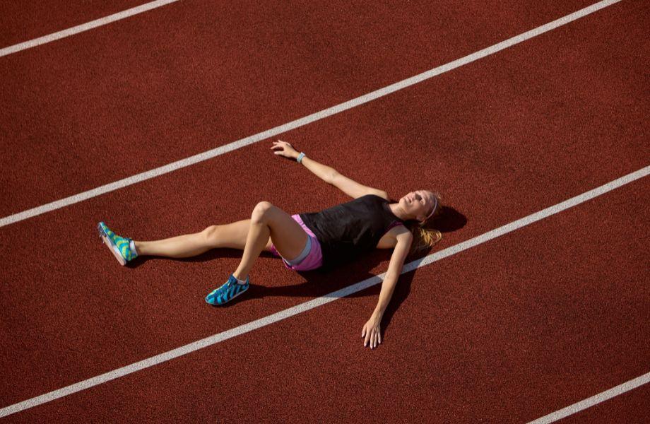 A women out of breath on a sports track