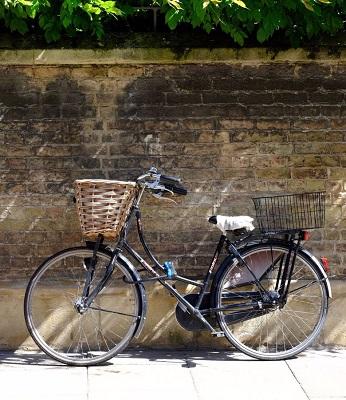 Bicycle leaning against a wall in Cambridge