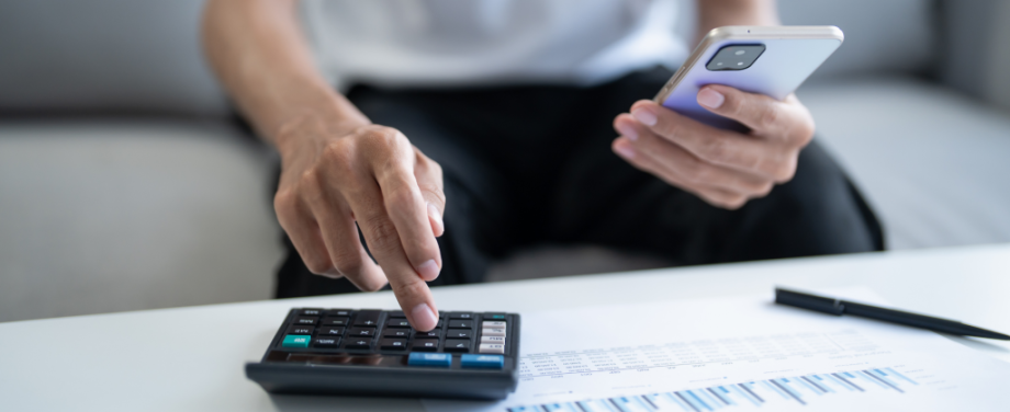 A man using a calculator