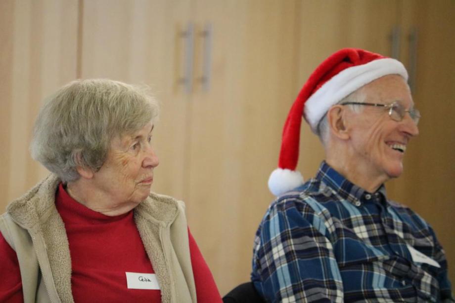 Two carers enjoy a Christmas party