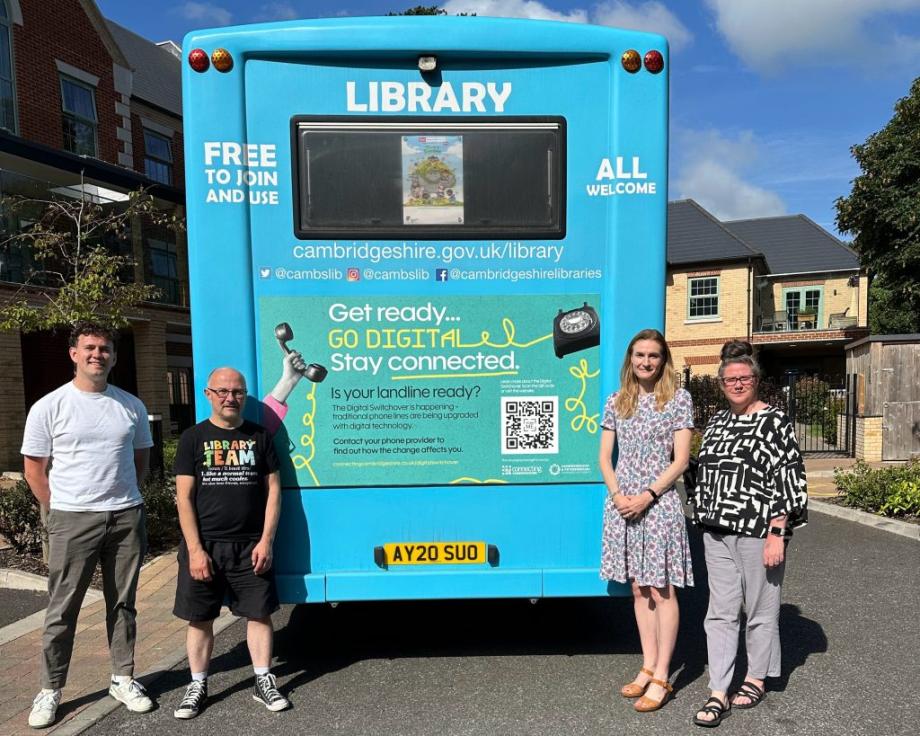From left to right: Will Plant, Digital Inclusion Lead at Connecting Cambridgeshire; Darren Harte, Mobile Library Driver; Katherine Hesketh, Head of Communications at Keystone; and Chantal Palmer, Head of Creative at Keystone stand alongside one of the mobile library vehicles displaying the campaign graphics
