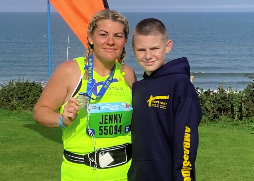 Jenny and Freddie Mann holding medal after Great North Run
