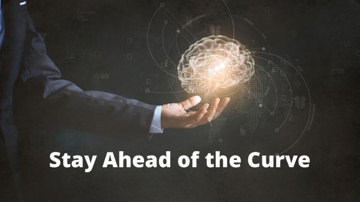 man's hand holding a brain shaped light, with the words:  'stay ahead of the curve'