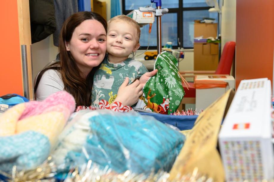 One of the children with the present they picked for their mum