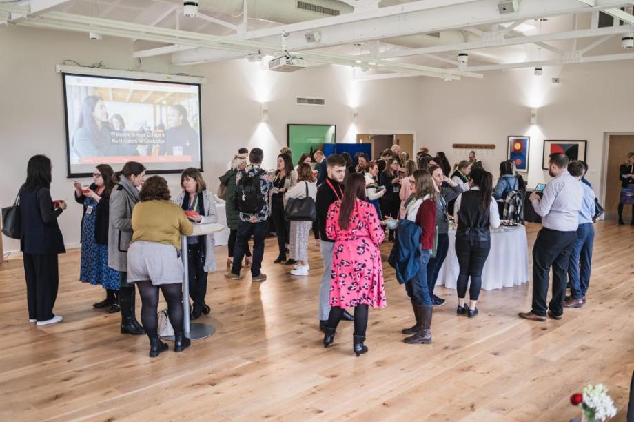 A diverse group of professional people networking at Jesus College Cambridge