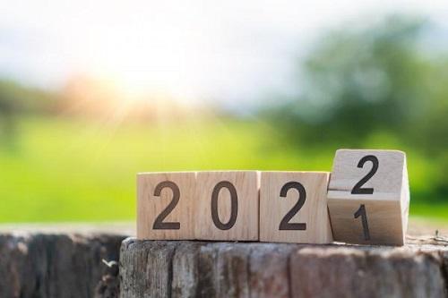 wooden blocks showing numbers changing from 2021 to 2022