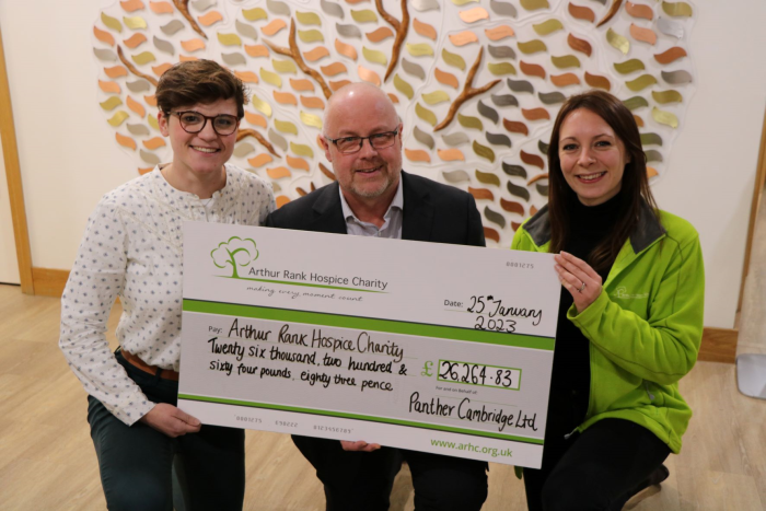 Panther taxis holding cheque with ARHC