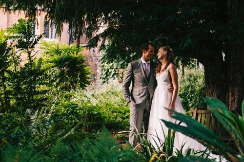 Wedding couple pictured in the grounds at Trinity Hall Cambridge College - photocredit Lee Allison Photography