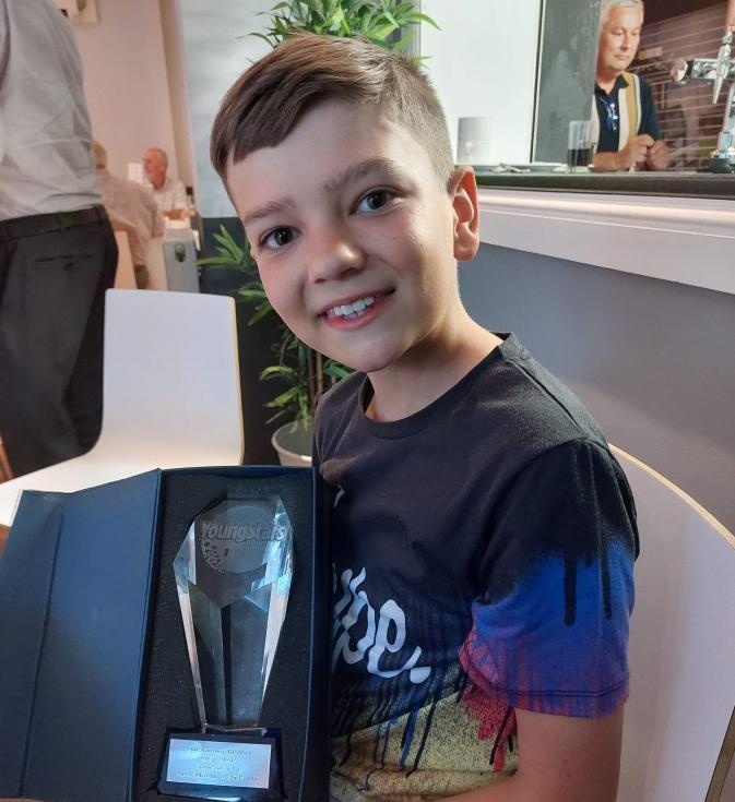 Riley with his award