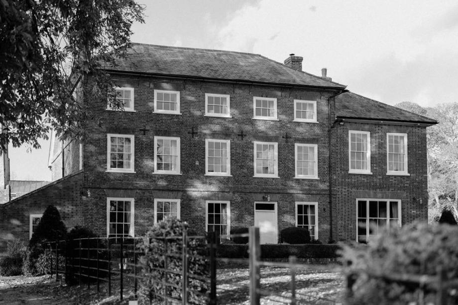 A black and white image of the Manor House