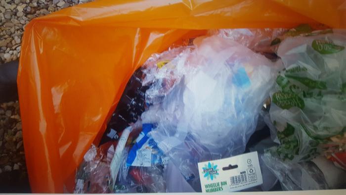 A collection of waste plastic in a plastic bag