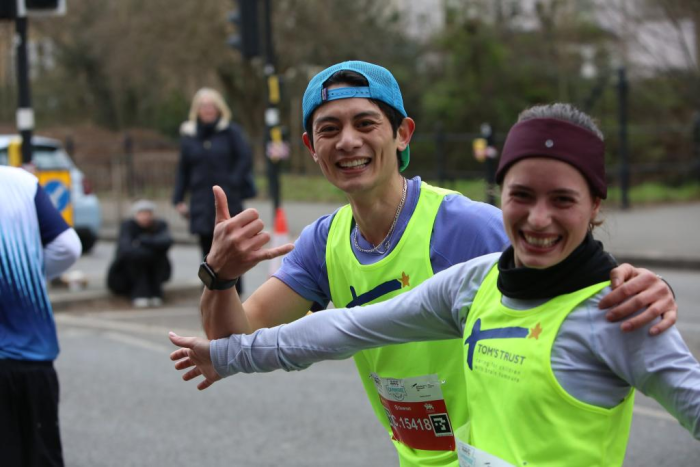 Tom's Trust runners giving a thumbs up