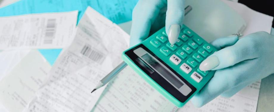 A woman using a a calculator