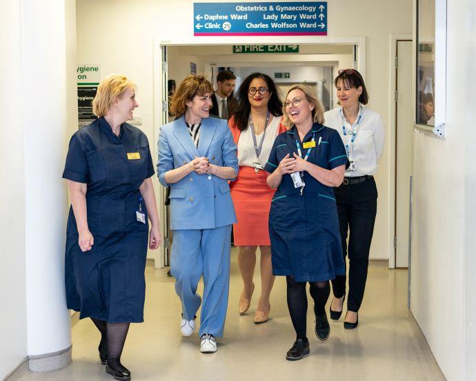 group of women walking through a hospital 