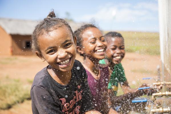 Girls happy to be washing their hands at their school's facilities provided by WaterAid, Madagascar. Credit: WaterAid/ Ernest Randriarimalala