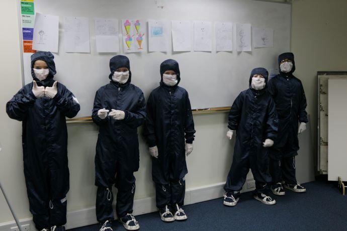 group of children in protective clothes 