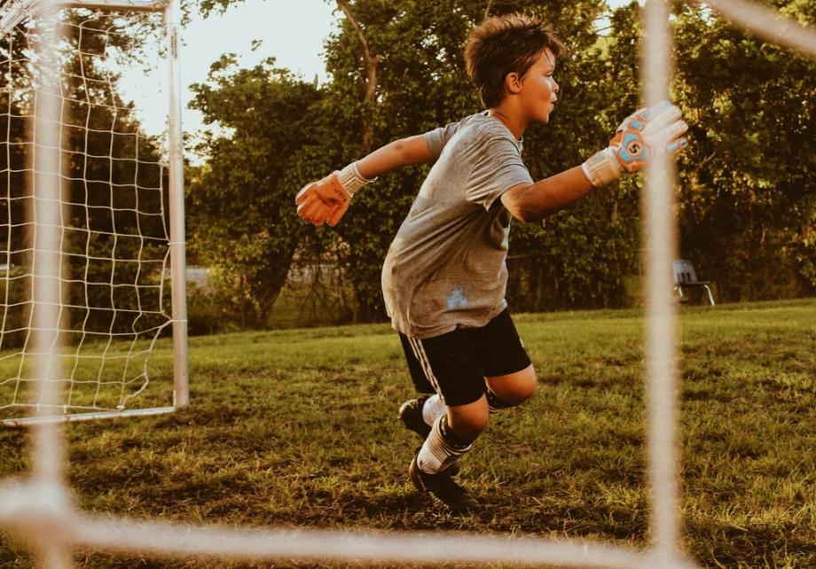 Child playing football