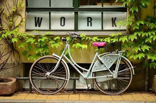 bicycle and sign saying 'Work' - Image by Free-Photos from Pixabay