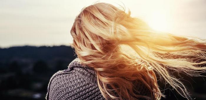 Girl seen from behind with hair blowing in the wind_Image credit: Pixabay