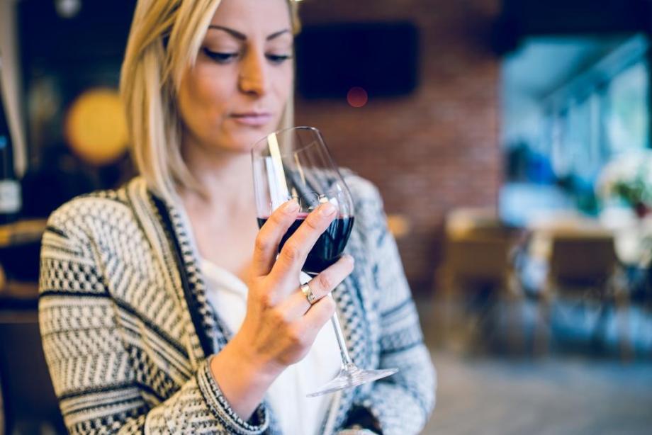 woman drinking wine and thinking about alcohol