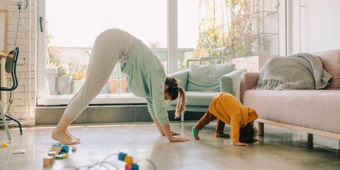 woman and child exercising at home
