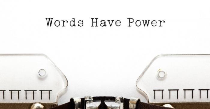 typewriter with 'words have power' written on its inserted paper
