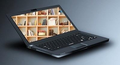 Laptop with image of library on screen   - Image by kalhh from Pixabay