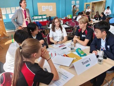 a group of school children brainstorming 