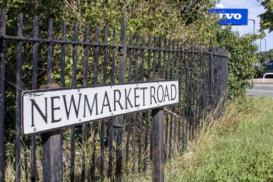 Newmarket Rd street sign on railings