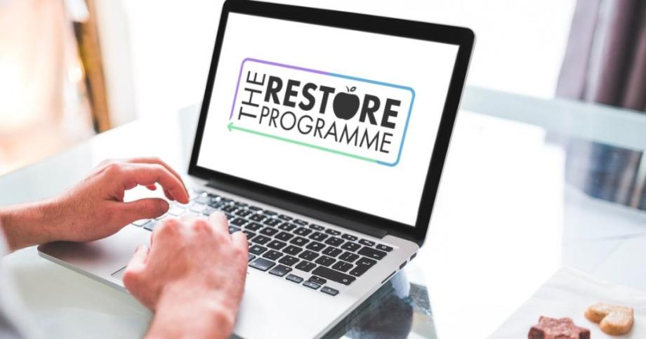 and laptop with the words the restore programme