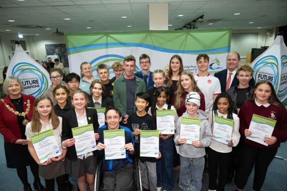 group of children holding certificates 