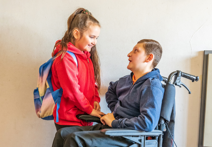 young carer with wheelchair user 