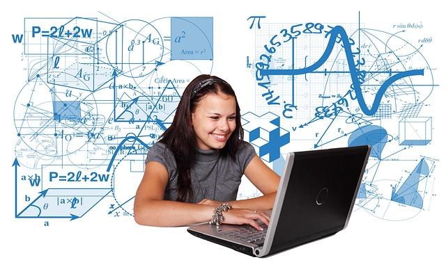 Girl at laptop with diagrams behind