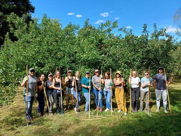 group of volunteers in an orchard