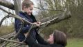 Photo of a young boy and his mother on a park's climbing frame