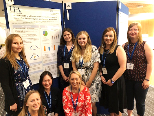 Presenting a poster at the 2018 BABCP conference in Glasgow, from left to right - clinical psychologists Dr Kate Roberts, Dr Emma Travers-Hill, Dr Youngsuk Kim, Dr Isobel Wright, Dr Lindsey Ridgeon, assistant psychologists Stephanie Casey and Rachel Elliott, and Support Time and Recovery worker (STR)/assistant psychologist Katherine Parkin.