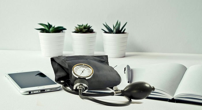 potted plants and tablet with stethoscope, pen and notepad, _ website health check